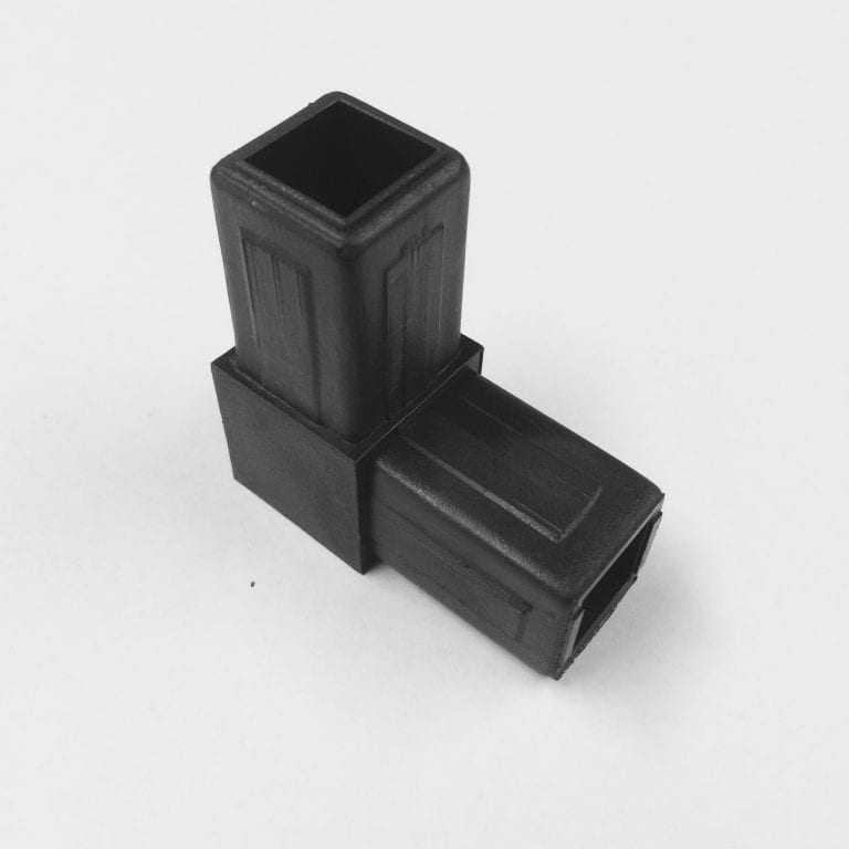 Two black plastic joiners on white background