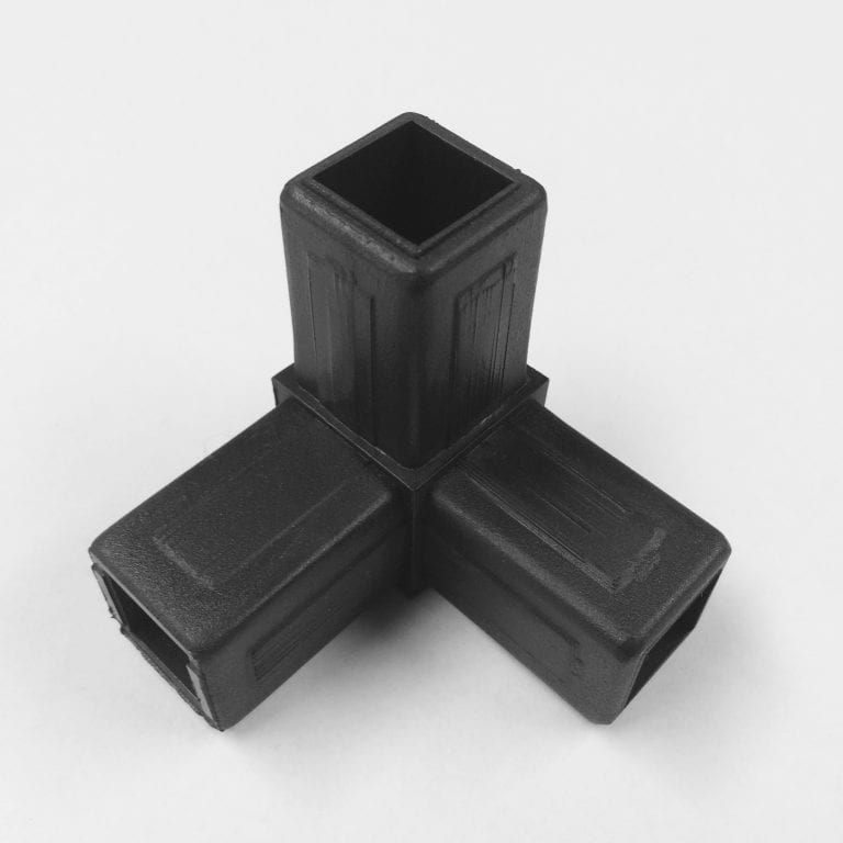 Three black plastic joiners on white background